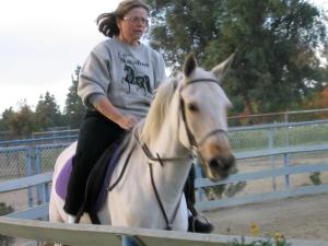 Kathie Benno rides one of her horses.